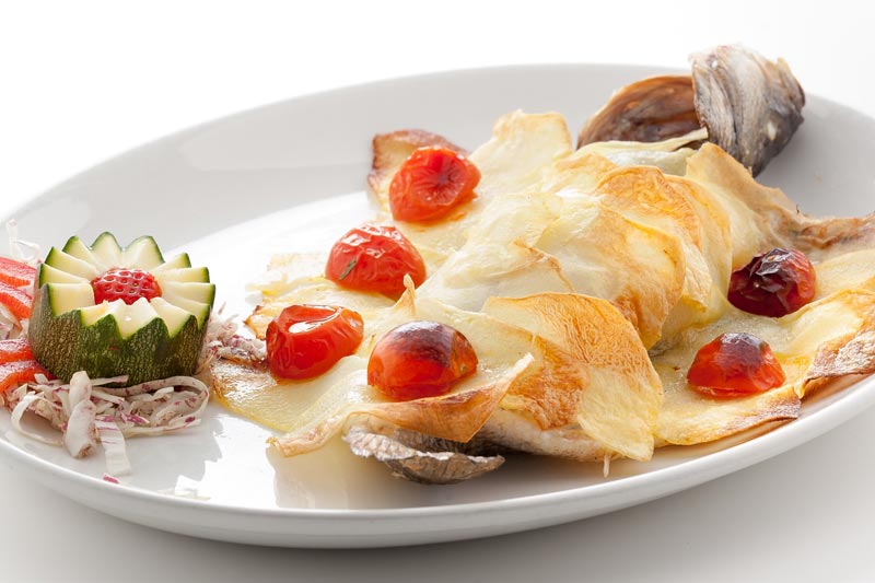 Pesce al forno in crosta di patate - Ristorante Lo Zodiaco Rimini